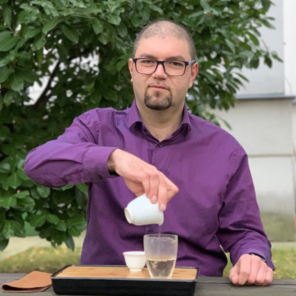 Pascal pouring tea outdoors